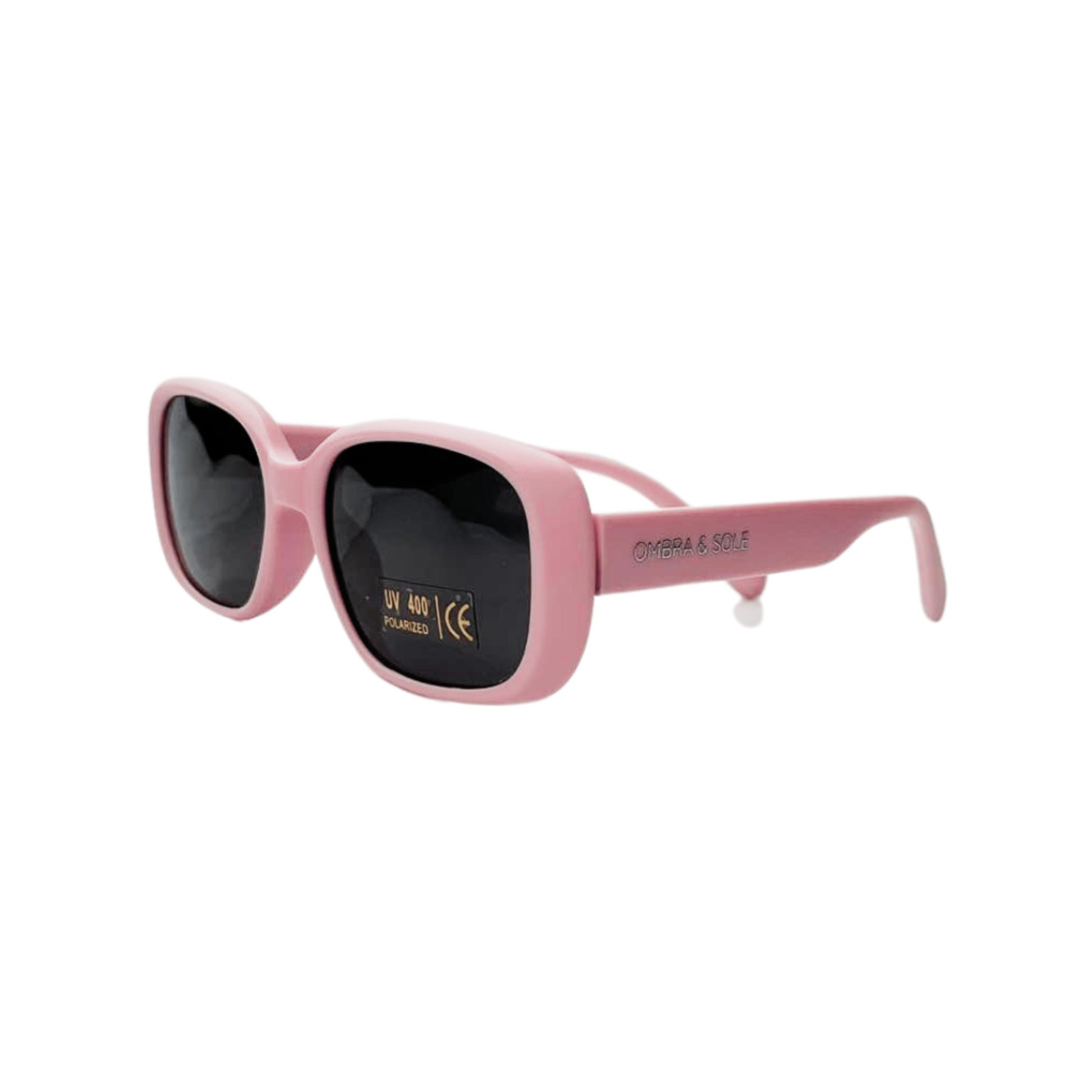 Angle view of kids UV polarised coral pink sunglasses showing flexible frames