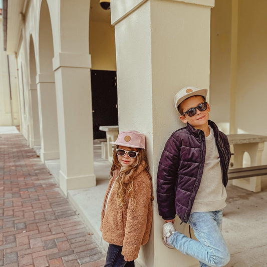 two children in ombra and sole corduroy hats and ubv400 polarised sunglasses